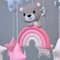 bear on a pink raibow