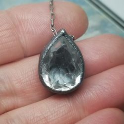 silver pendant with white quartz