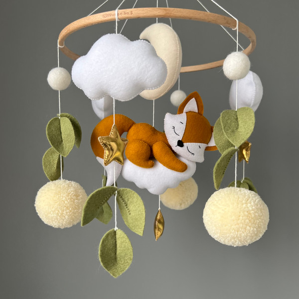 mobile with fox on the cloud