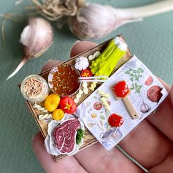 Miniature doll set with a cookbook for playing in a dollhouse, scale 1:12, polymer plastic