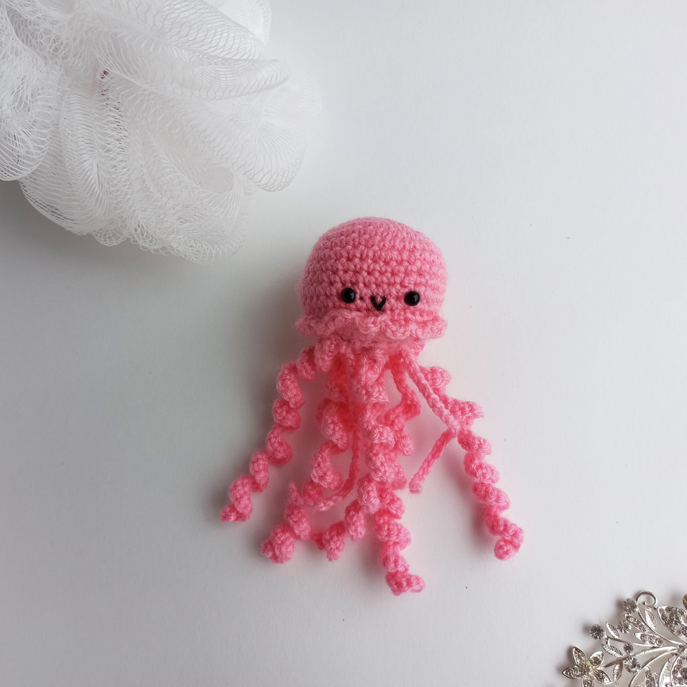 Pink crochet jellyfish on the white background 1.jpg