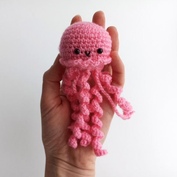 Pink crochet jellyfish amigurumi in the hand 4.jpg