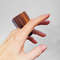 Brown wood tall ring, hand