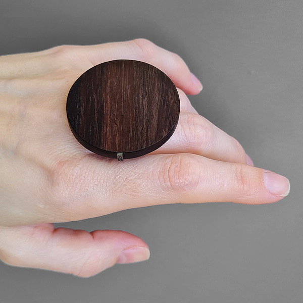 brown wood, round ring, hand