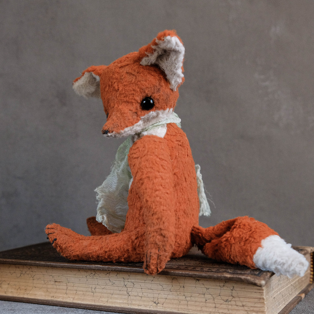 little red fox with silk ribbon