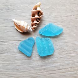 patterned electric blue sea glass.