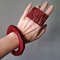 hand, red bracelet, red rectangular ring