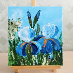 Blue accent wall living room painting irises in acrylic
