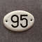 95 apartment address number plate sign white black