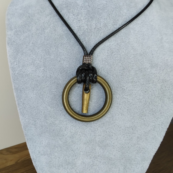 Brass-circle-pendant-on-cord
