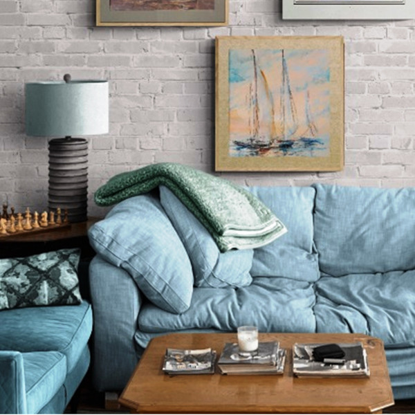 Artwork with yachts above the sofa and coffee table.jpg