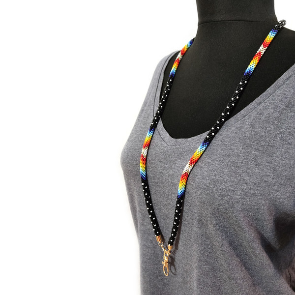 Black beaded lanyard on a mannequin