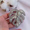Silver-Monstera-leaf-handmade-beaded-brooch-wirh-shiny-crystars.jpg