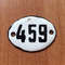 white black small apartment door number sign 459