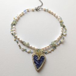 Pearl necklace with embrodered heart pendant