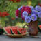 Photo of colorful bouquet of asters and watermelon