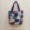 ppMma11hutI.jpg-A medium-sized denim handbag in the boro technique is quilted from pieces of cotton fabrics,
