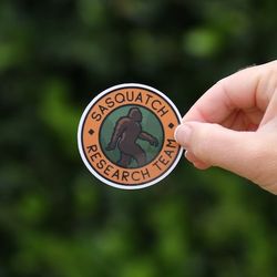 sasquatch research team, bigfoot waterproof vinyl sticker, uv resistant decal, laptop, water bottle, car window sticker
