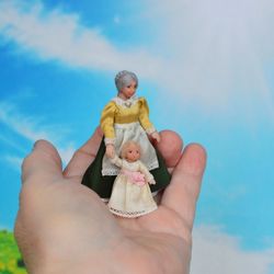 Miniature dolls in 24th scale. A grandmother with a baby for a dollhouse.