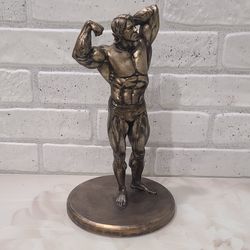 Arnold figurine / bodybuilder trophy present