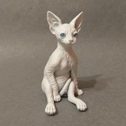 Baby sphynx cat sculpture white realistic eyes.