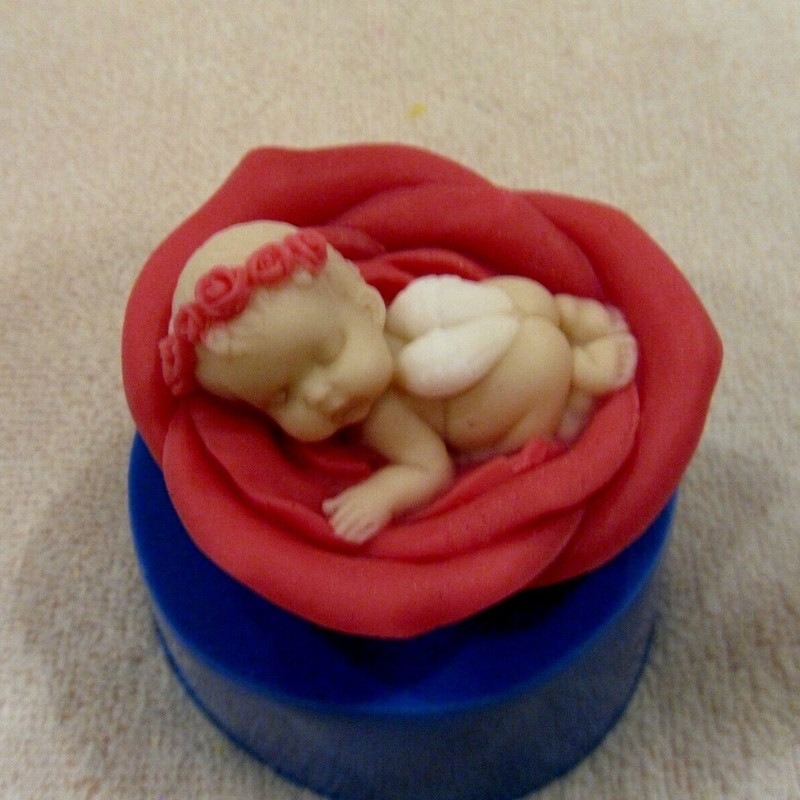 Angel sleeping on flower soap