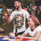 tattooed-man-wearing-a-tshirt-mockup-drinking-a-beer-at-a-4th-of-july-bbq-party-a20832 (8).png