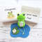 Small-Frog-plush-on-the-pond