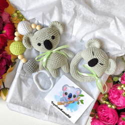 Baby gift box koala. Baby rattle, stroller toy