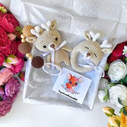 Baby gift box deer. Baby rattle, stroller toy