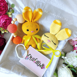 Baby gift box yellow bunny. Baby rattle, stroller toy