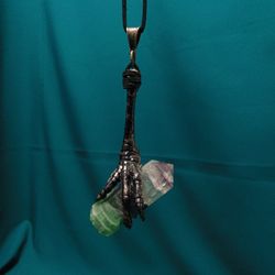 Tourmaline polychrome in Ravens foot.Pendant neclace. All natural