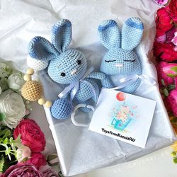 Baby gift box blue bunny. Baby rattle, stroller toy