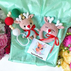Baby gift box deer. Baby rattle, stroller toy.