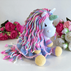 Crochet animal. Unicorn toy blue, pink, purple, yellow