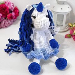 Crochet unicorn in blue shades. Crochet toy as a gift for a girl for the New Year or her Birthday.