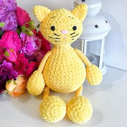 Crochet animal. Plush cat yellow