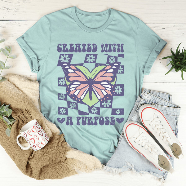created-with-a-purpose-tee-heather-prism-dusty-blue-s-peachy-sunday-t-shirt