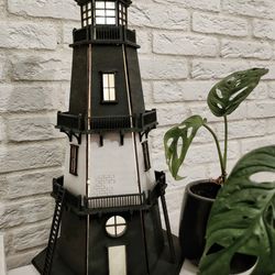 Lighthouse night light lamp in the style of Wednesday
