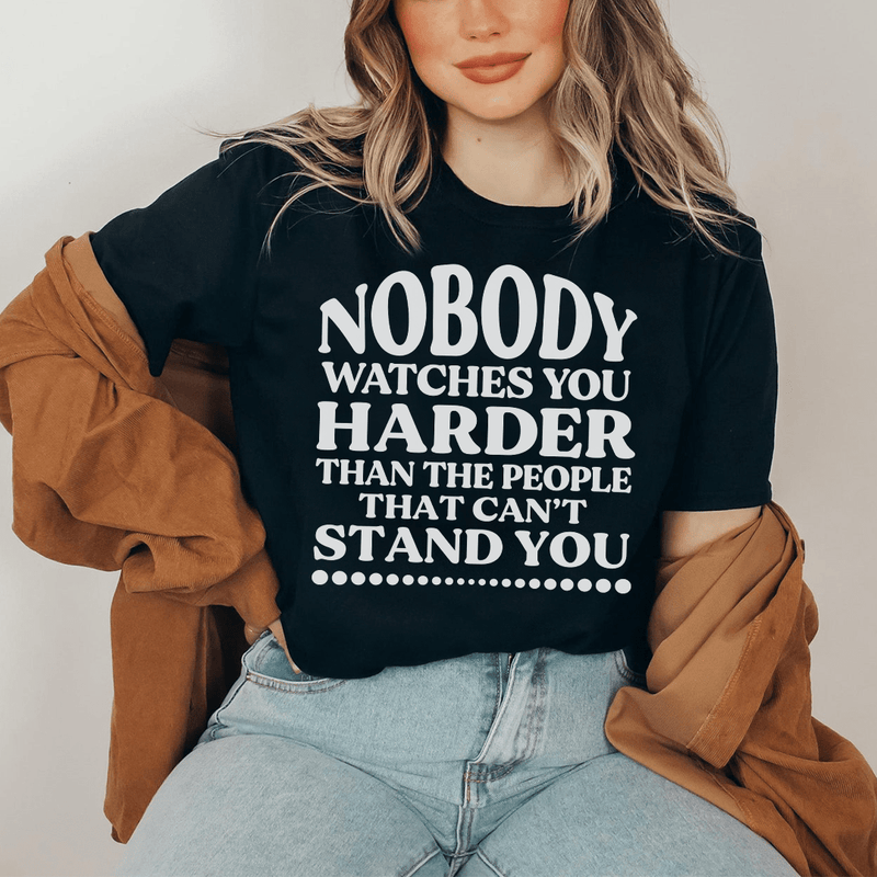 nobody-watches-you-harder-than-the-people-that-can-t-stand-you-tee-black-heather-s-peachy-sunday-t-shirt