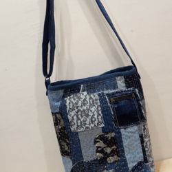 Quilted bag made of pieces of cotton and denim in the style of boro pechwork