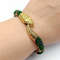 Green snake beaded bracelet on hand