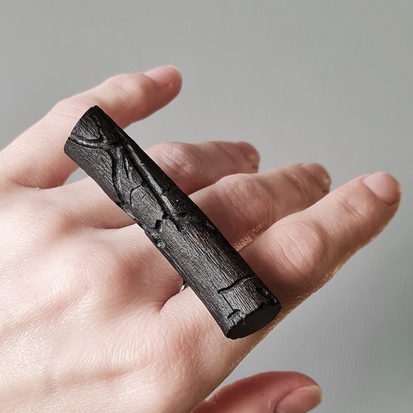 black ring, ring on the hand, wooden ring