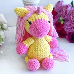 Crochet animal. Unicorn plush toy yellow, pink