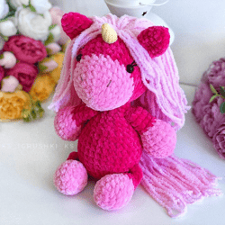 Crochet animal. Unicorn plush toy crimson, pink