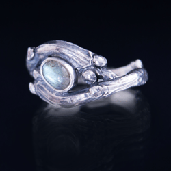 Silver massive ring made of twigs with labradorite