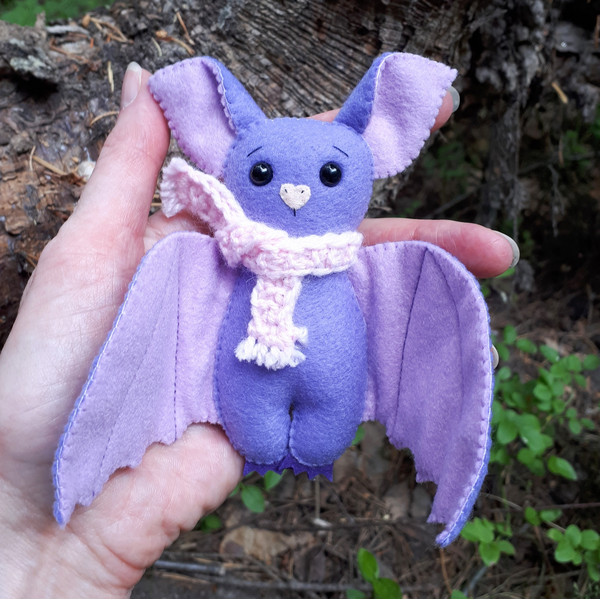 Purple-Bat-plush-in-the-woods