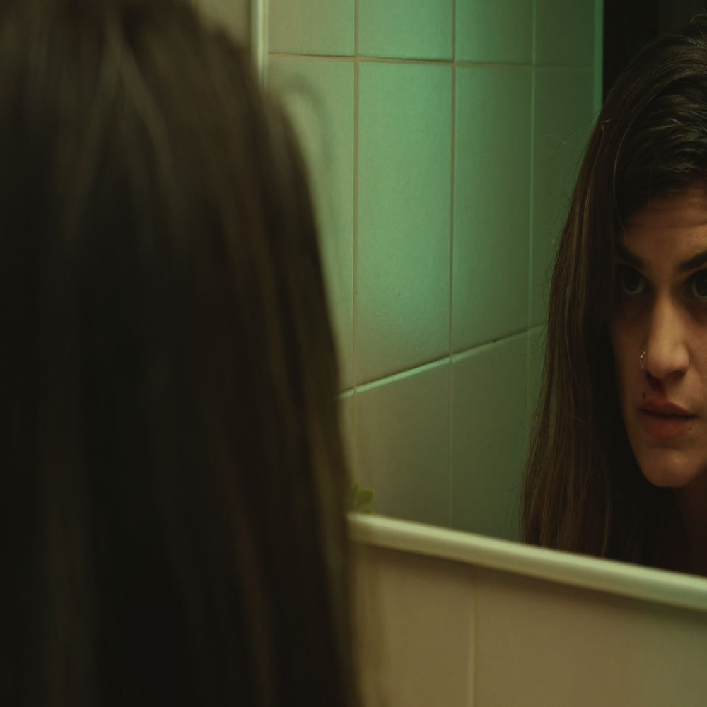 1080x1080 size woman-wiping-blood-from-her-forehead-and-nose-in-front-of-a-mirror-convert-video-online.com_.00_00_06_00.Quadro001-1594x1062.jpg