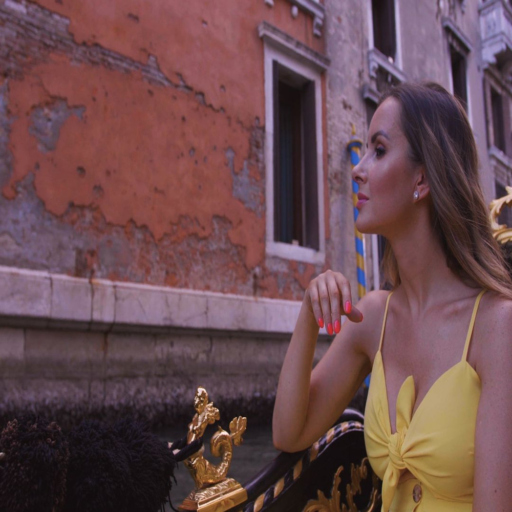 1080x1080 size woman-in-a-yellow-dress-riding-in-a-canal-boat-in-Venice-convert-video-online.com_.00_00_07_24.Quadro002-1594x1062.jpg