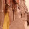 1080x1080 size woman-wearing-a-yellow-dress-and-walking-next-to-a-canal-and-buildings-convert-video-online.com_.00_00_07_24.Quadro001-1594x1062.jpg